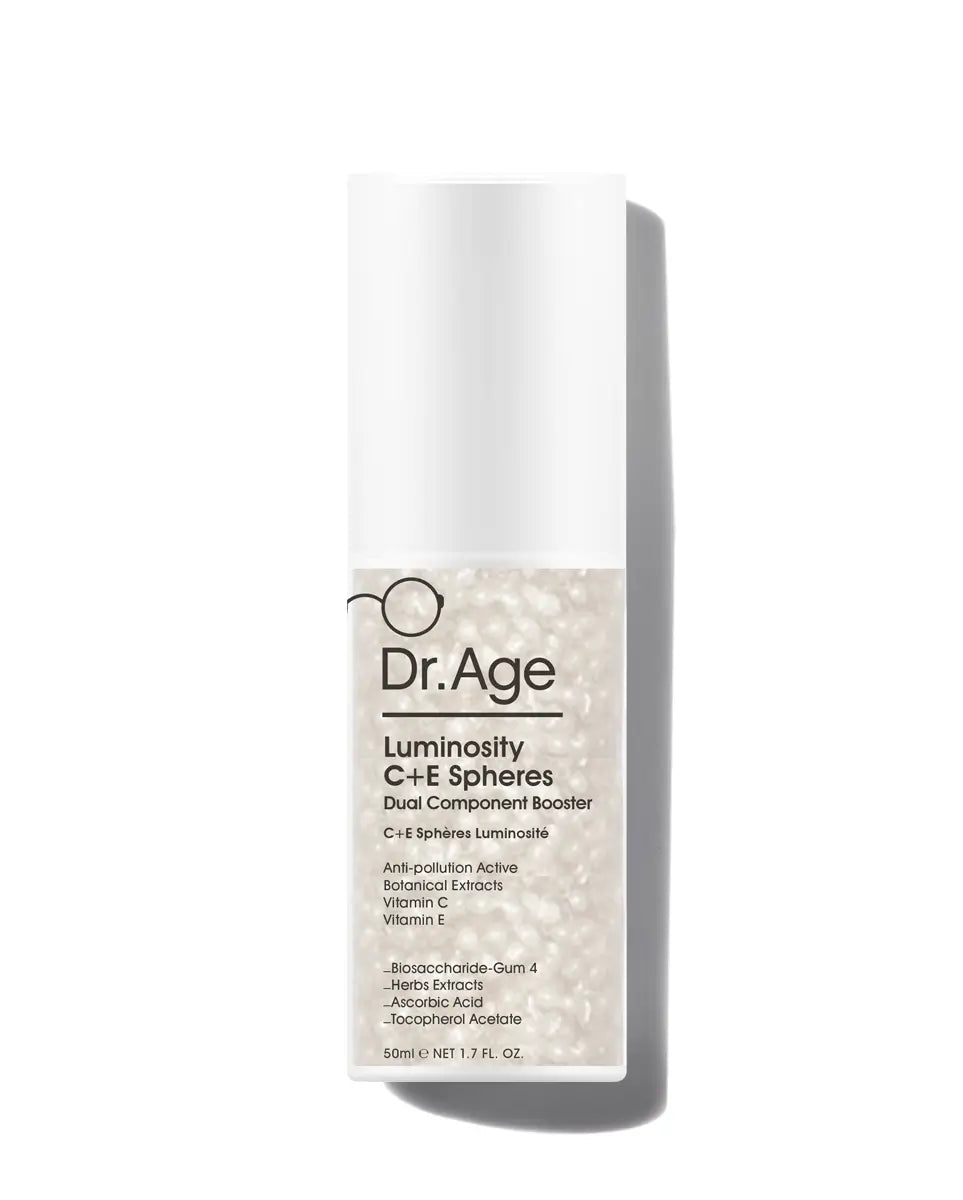 Dr. Age Luminosity C+E Spheres Dual Component Booster in a white cylindrical bottle with a clear lower section showing shimmering beige spheres, set against a plain white background with a soft shadow.
