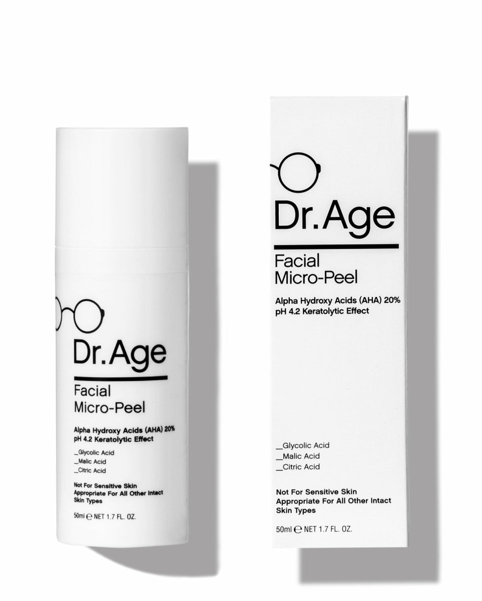 Dr. Age Facial Micro-Peel skincare set featuring a white cylindrical pump bottle and its matching white retail box, both printed with black text and a minimalist eyeglasses icon, set against a clean white background.