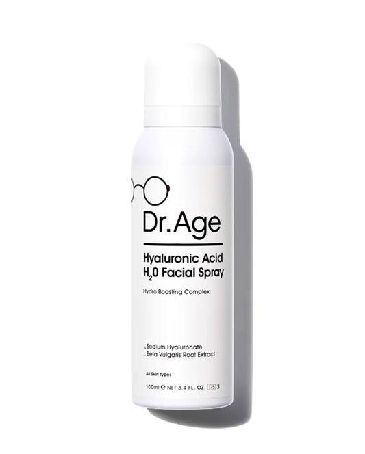 A white cylindrical spray bottle of Dr. Age Hyaluronic Acid H2O Facial Spray, featuring black text and a minimalist eyeglasses logo, set against a clean white background with a soft shadow.
